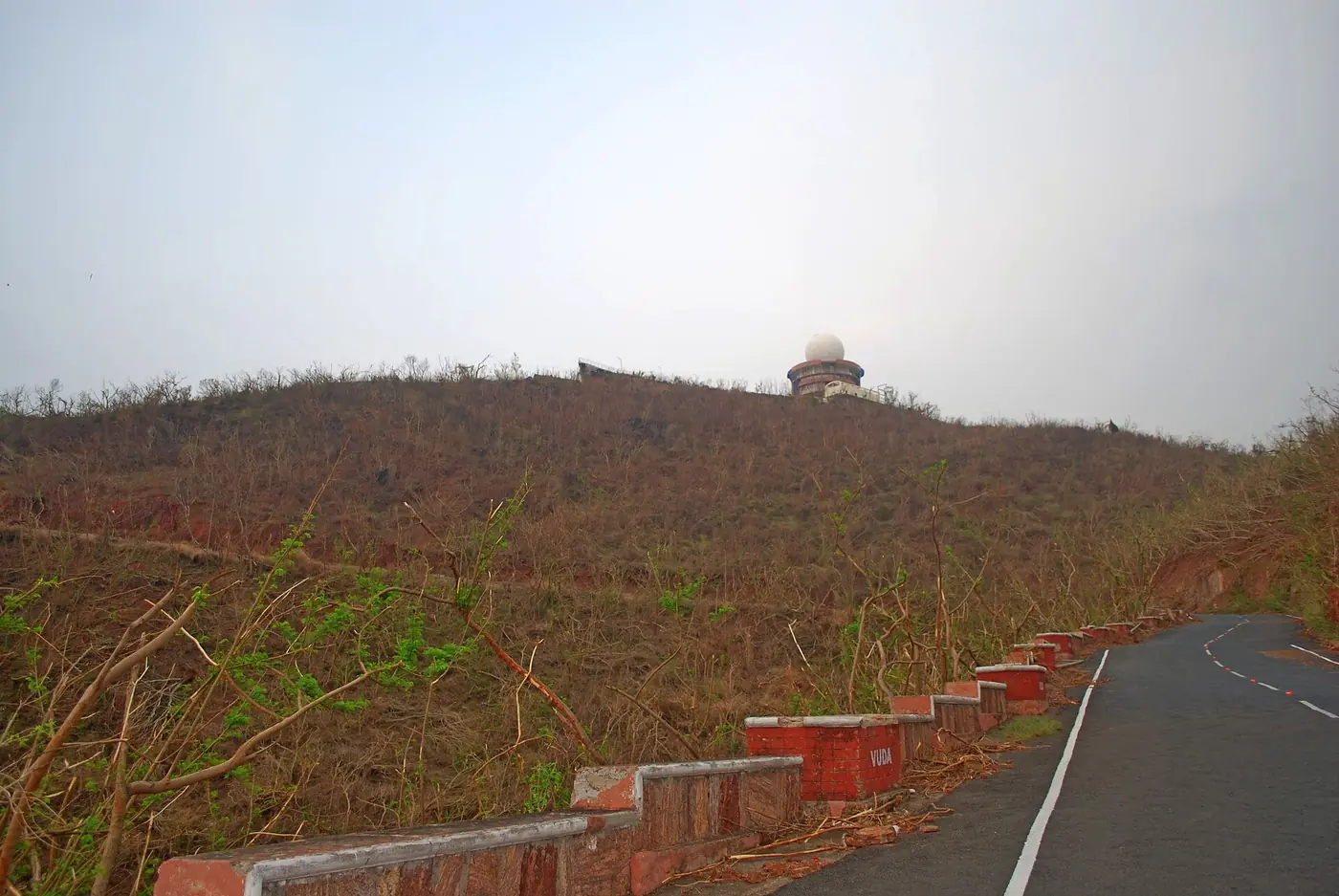 Photograph of Kailasagiri hill in Visakhapatnam with its slopes stripped bare of trees after Cyclone Hudhud