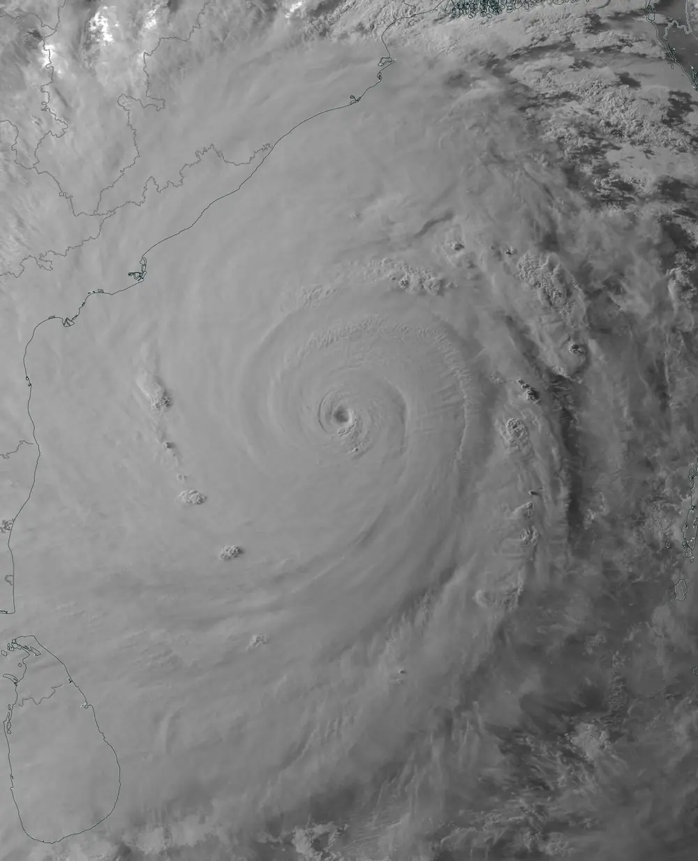 Black-and-white infrared satellite image of Amphan showing a tiny eye inside a bright ring of cold cloud tops