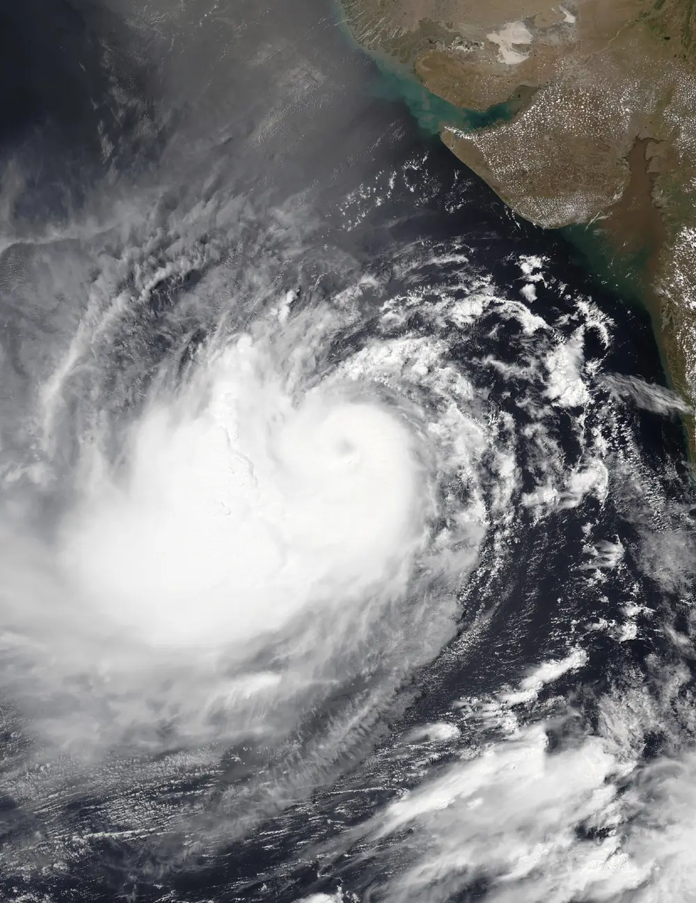 Satellite image of Cyclone Biparjoy over the Arabian Sea with a well-defined eye
