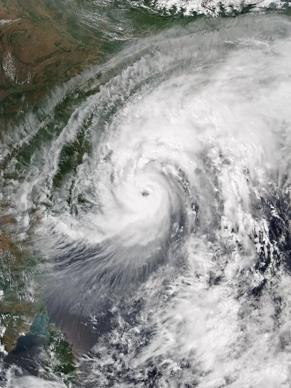 Satellite image of Cyclone Titli approaching the north Andhra Pradesh and south Odisha coasts with a small eye